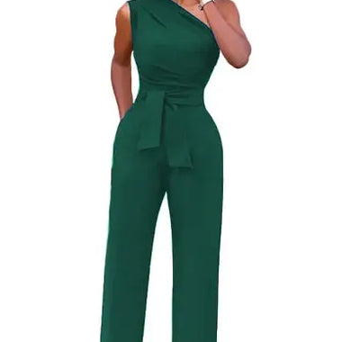 a woman in a green jumpsuit talking on a cell phone