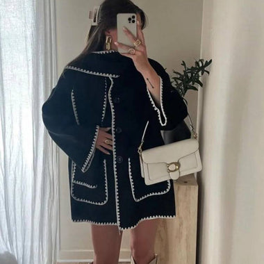 a woman taking a selfie in a mirror