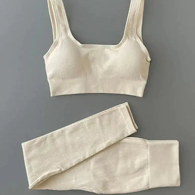 a crop top and leggings on a gray background