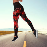 a woman is running down the road in a red and black outfit