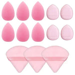 a set of pink makeup sponges and brushes