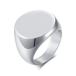 a silver ring with a circular design on it