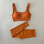 an orange sports bra top and matching leggings