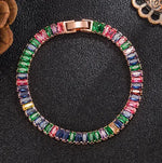 a bracelet with multicolored stones on a black surface