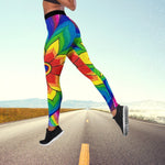 a woman is running down the road in colorful leggings