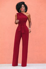 a woman in a red jumpsuit posing for a picture