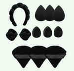 a set of black hair accessories including a pair of scissors