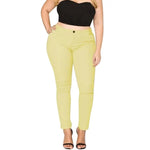 a woman in a black top and yellow pants