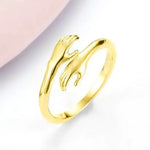 a gold ring with a dolphin on it