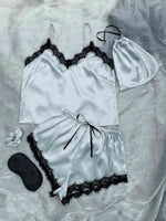 a woman's white and black lingerie set