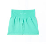 a girl's green shorts with the word nvgtn on it