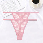 a cup of coffee next to a pink bra