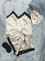 a woman's lingerie and a pair of shoes on a bed