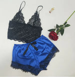 a pair of underwear and a rose on a table