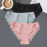 three women's underwear with laces and a cup of coffee