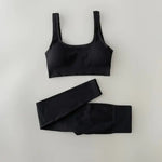 a black sports bra top and leggings