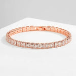 a rose gold bracelet with square cut stones