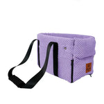 a purple bag with a black strap