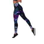 a woman in black and purple floral print leggings