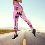 a woman in a pink floral print leggings is standing on the side of