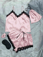 a woman's pink lingerie and a pair of black shoes