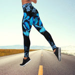 a woman is running down the road in a blue butterfly print leggings