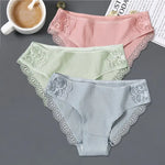 three women's underwear with laces and a cup of coffee