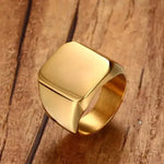 a gold ring sitting on top of a wooden table