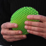 a person holding a green object in their hands