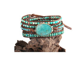 a bracelet with turquoise beads and a turquoise stone