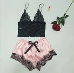 two pieces of lingerie next to a rose