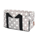 a gray and white polka dot dog carrier