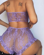 a woman in a purple lingerie with a tattoo on her back