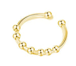 a gold beaded nose ring on a white background