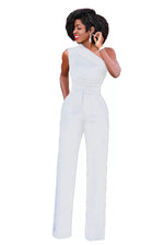 a woman in a white jumpsuit talking on a cell phone