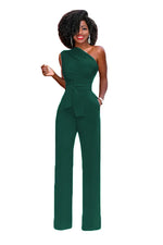 a woman in a green jumpsuit posing for a picture