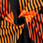 a close up of a black and orange striped fabric