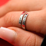 a close up of a person's hand with a ring on it