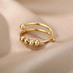 a close up of a gold ring on a cloth