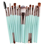 a large set of makeup brushes with a brush holder