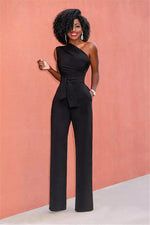 a woman in a black jumpsuit posing for a picture