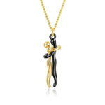 a black and gold necklace with a black and gold pendant