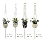 three hanging planters with plants in them