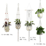 a group of hanging planters with plants in them