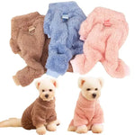 four different colors of dog clothes on a white background