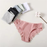 a baby girl's panties and a flower on a white background