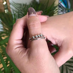 a woman's hand with a ring on it