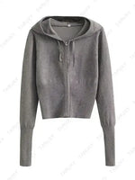 a women's grey sweater with a hoodie