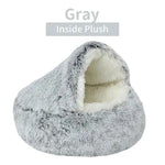 a gray dog bed with a white background