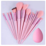 a set of pink makeup brushes next to a pink powder